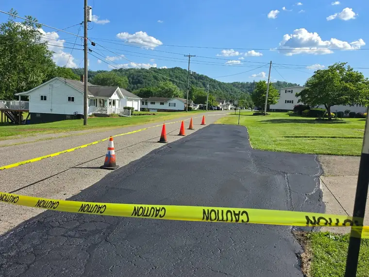 Same driveway freshly sealcoated