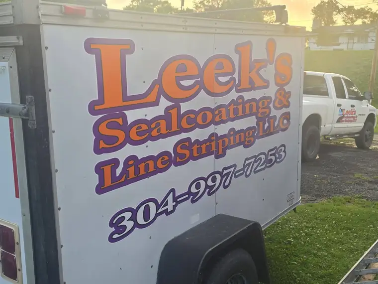 Leek's Sealcoating and Line Striping trailer with phone number 304-997-7253