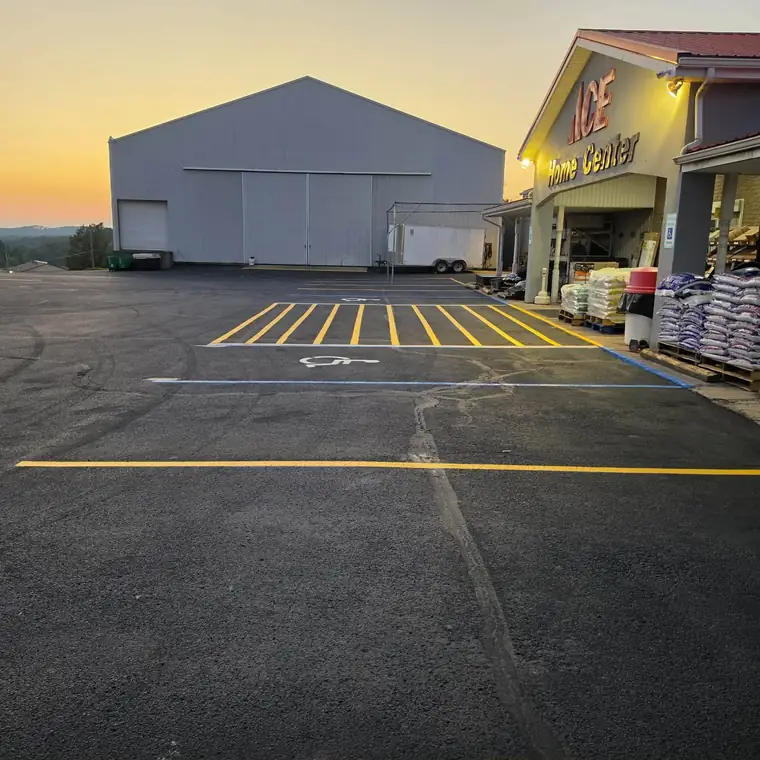 ADA stall and yellow hatched aisle at a store entrance