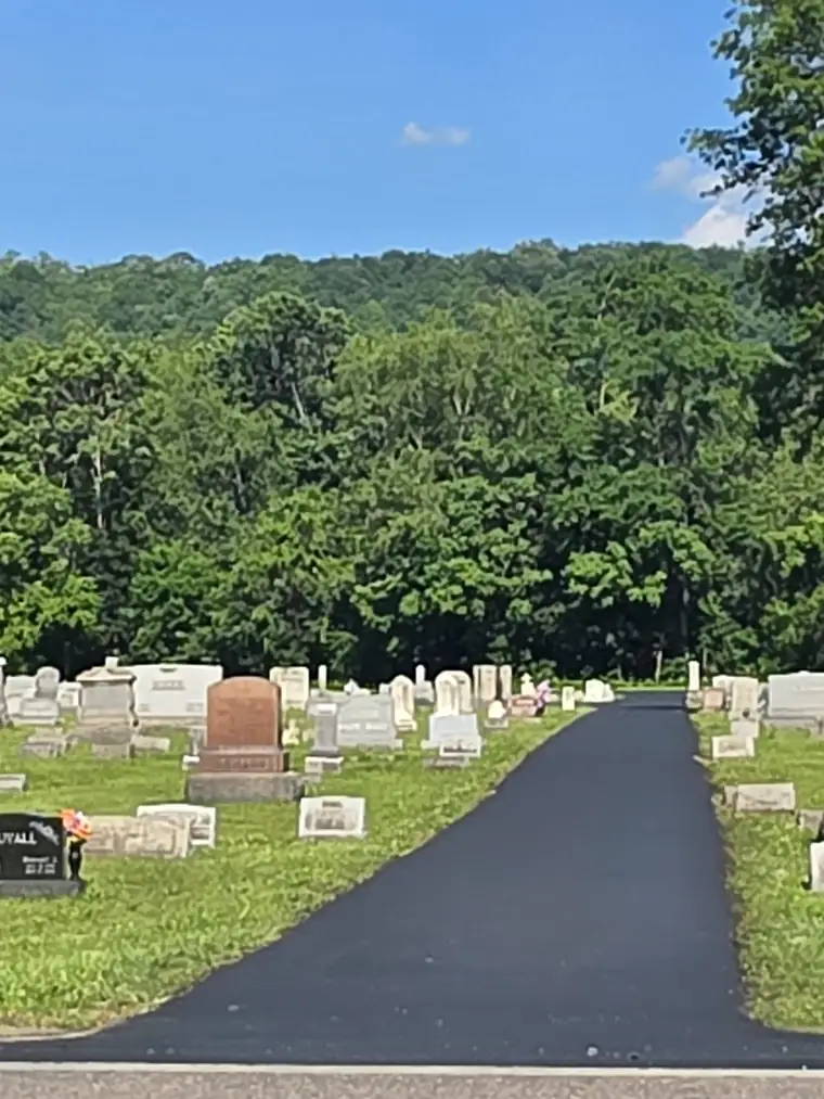 Cemetery drive with fresh sealcoat