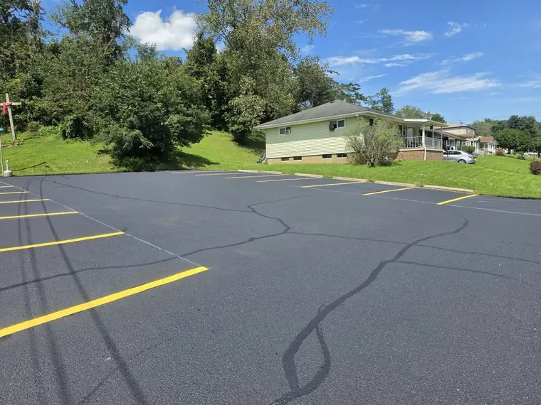 Church lot with fresh stall lines on a hillside