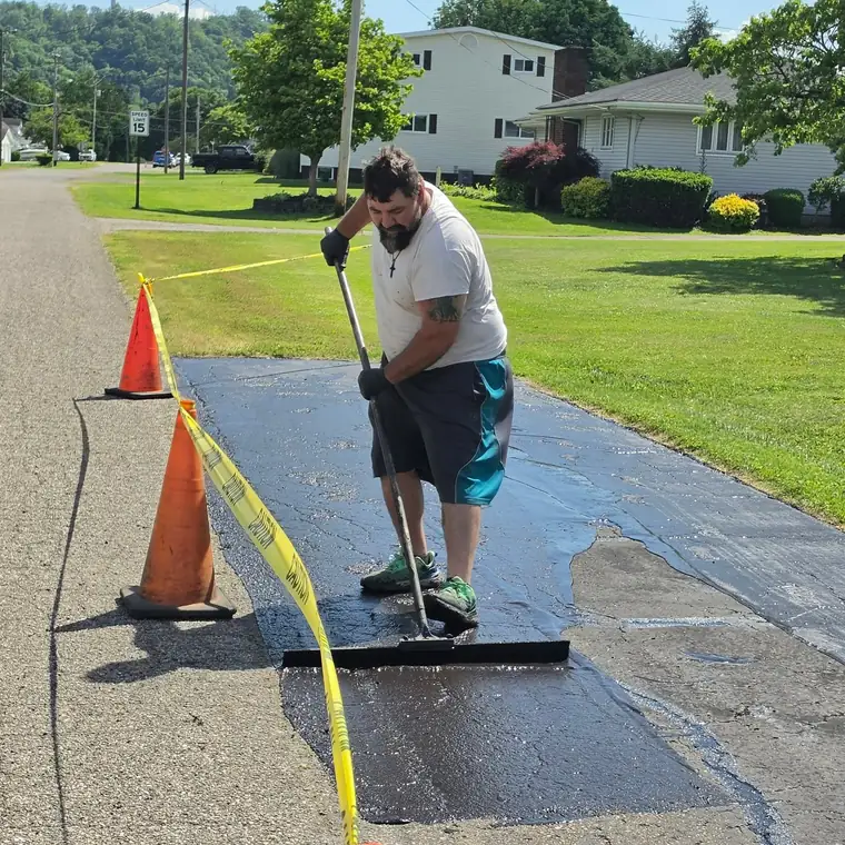 Sealcoating a residential driveway by squeegee, New Martinsville, WV