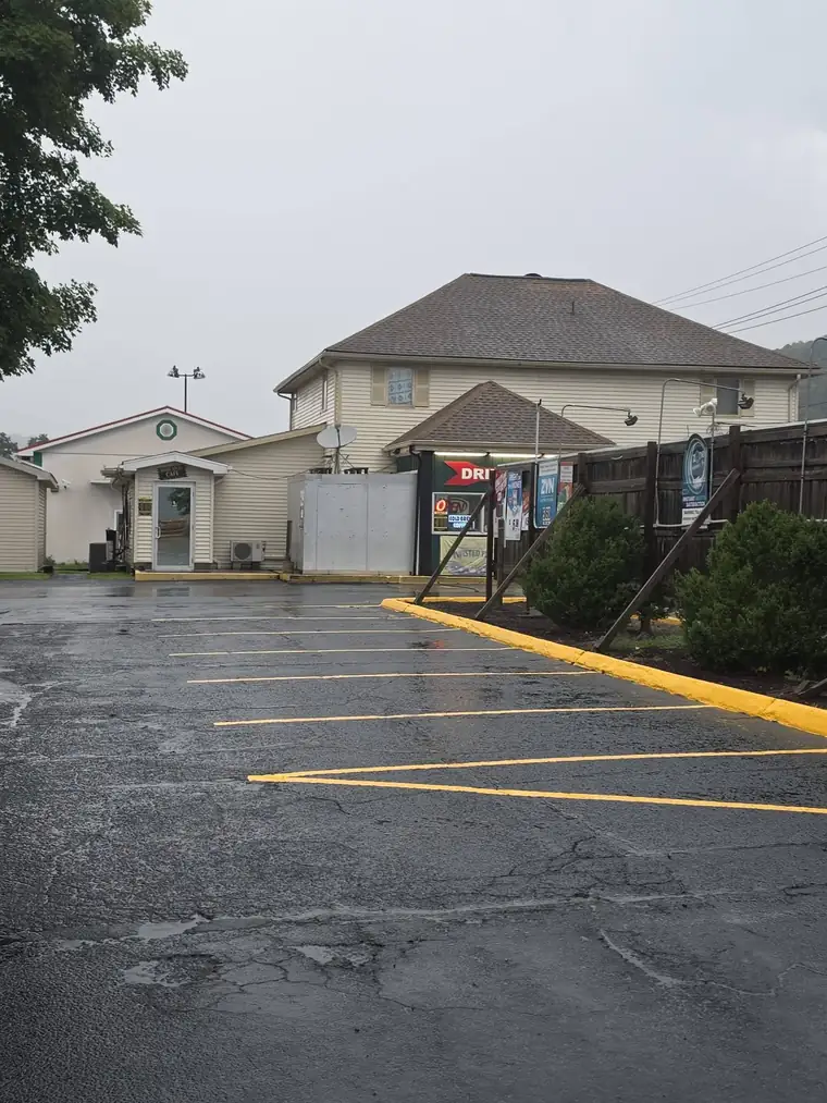 Convenience store lot sealed with yellow curb